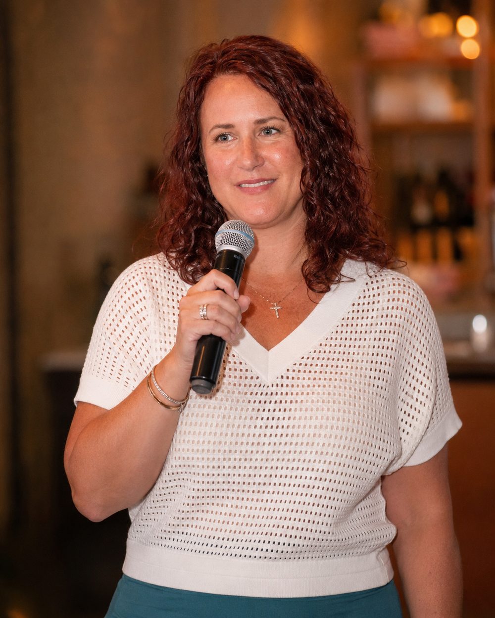 Angela Goodman speaking with a microphone